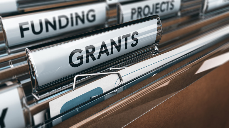 Inside of file cabinet with labels for funding, projects, and grants