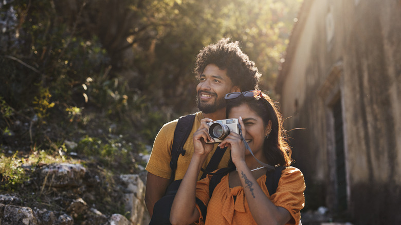 Tourist couple taking pictures