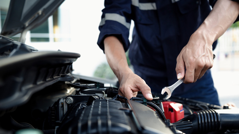 Mechanic fixing an engine