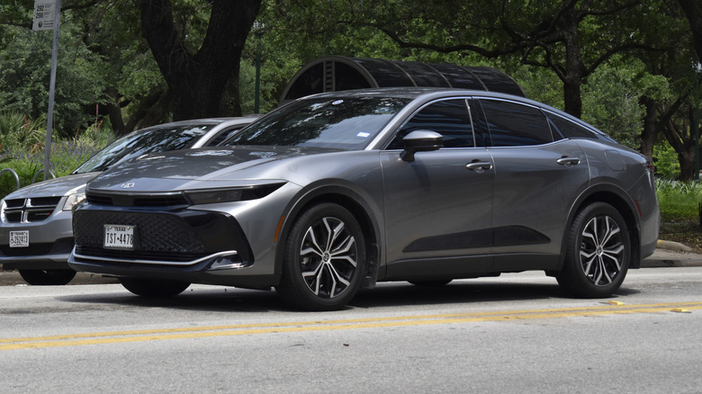 Gray Toyota Corolla being driven on a city street