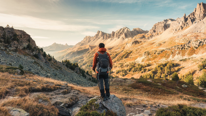 Male hiker hiking with enjoying the French Alps scenic