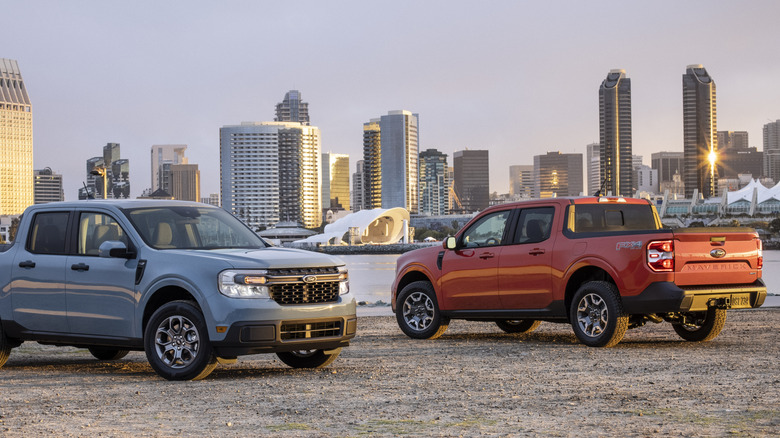 Two Ford Maverick trucks parked at scenic viewpoint