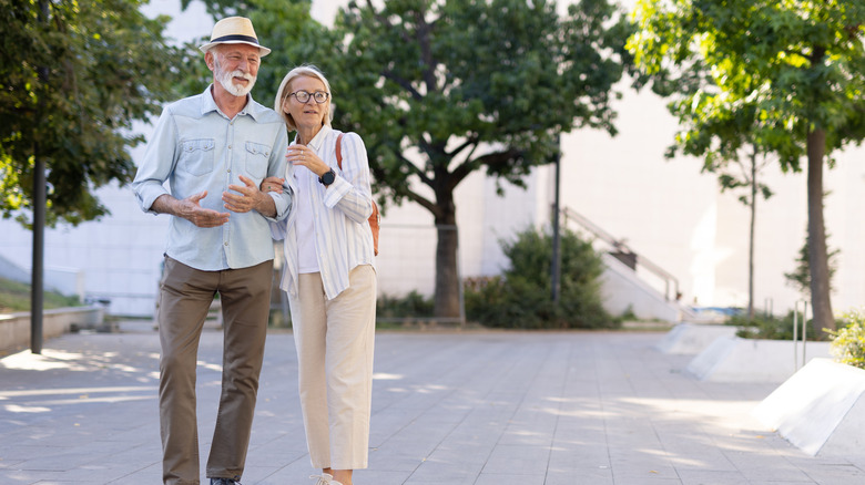 An senior couple in a city park