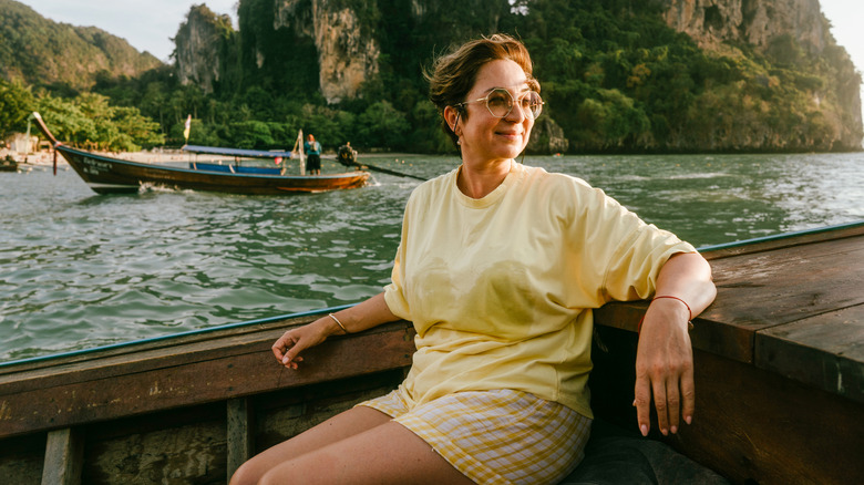Happy beautiful woman of pre-retirement age in sunglasses