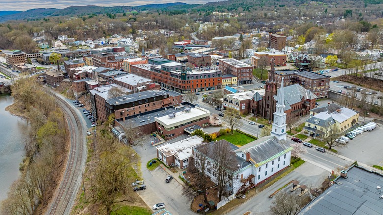 Spring aerial photo of the Town of Brattleboro, Vermont on a partly cloudy day.