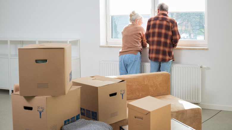 Senior couple with moving boxes