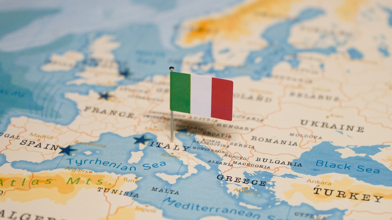Map of Italy with flag pinned in middle.