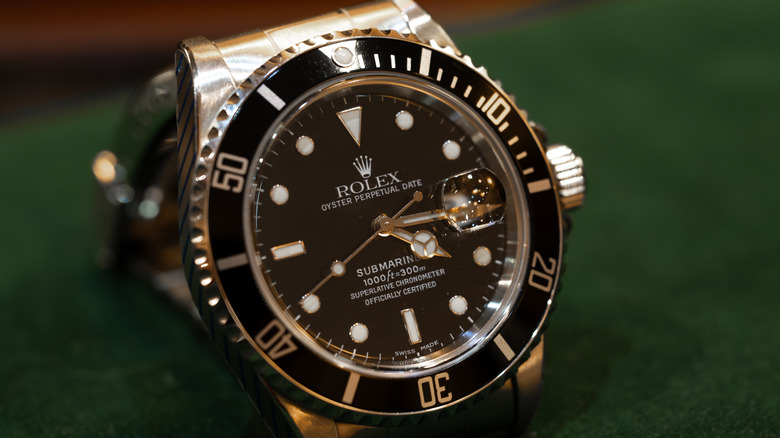 A second hand Rolex Oyster Perpetual Submariner Date watch is displayed for sale
