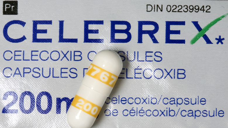 an anti-inflammatory celebrex pill laying on top of a celebrex label