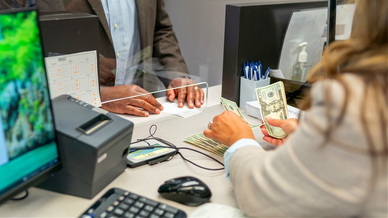 Person cashing check at bank