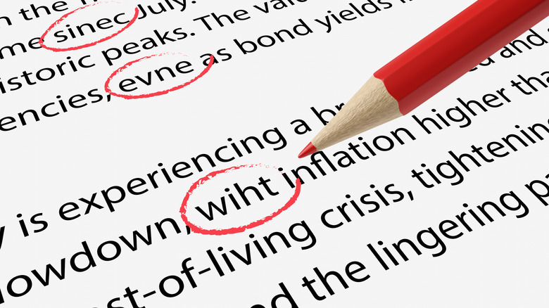 Printout full of typo mistakes circled by a red pencil.