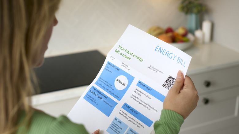 Woman reading an energy bill
