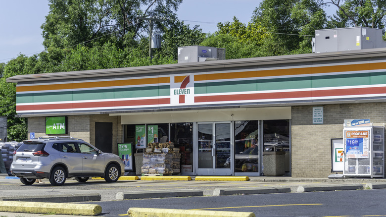 A car parked outside of a Michigan 7-Eleven on a sunny day