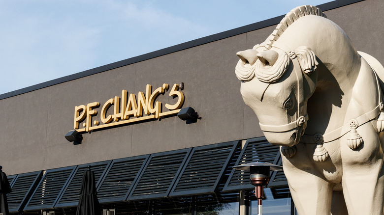 exterior of P.F. Chang's with signage and statue of a horse