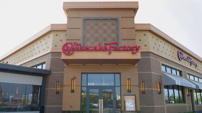 front entrance of The Cheesecake Factory with signage above the front door
