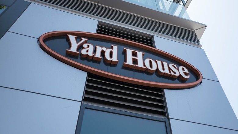 the Yard House sign attached to a building