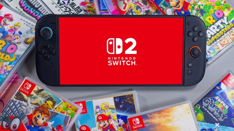 A Nintendo Switch 2 gaming device surrounded by different game cartridges.