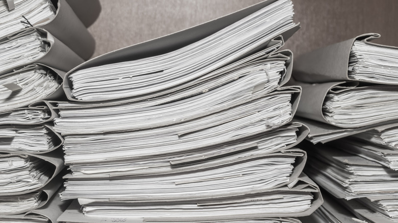 Stacks of documents filed in folders