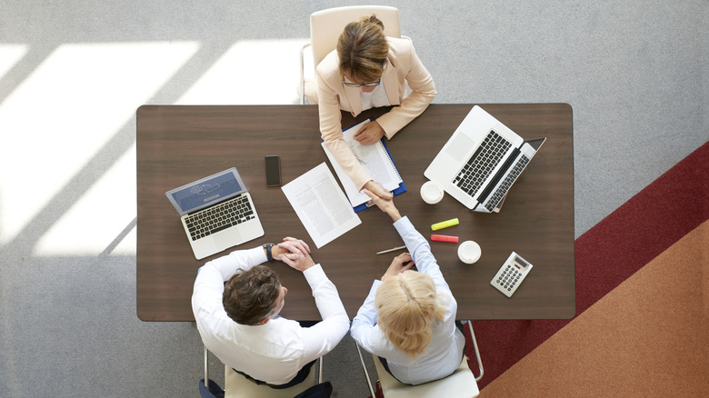 Senior couple meeting with advisor.