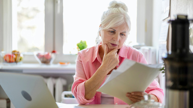 senior looking over documents