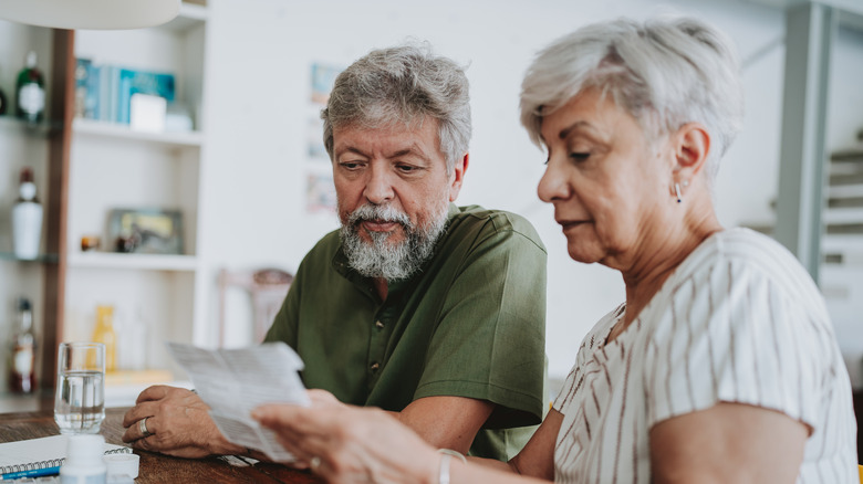 Senior couple looking at paperwork