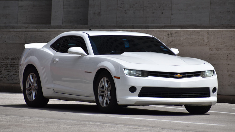 White Chevy Camaro cruising
