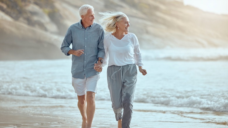 a retired couple on a beach