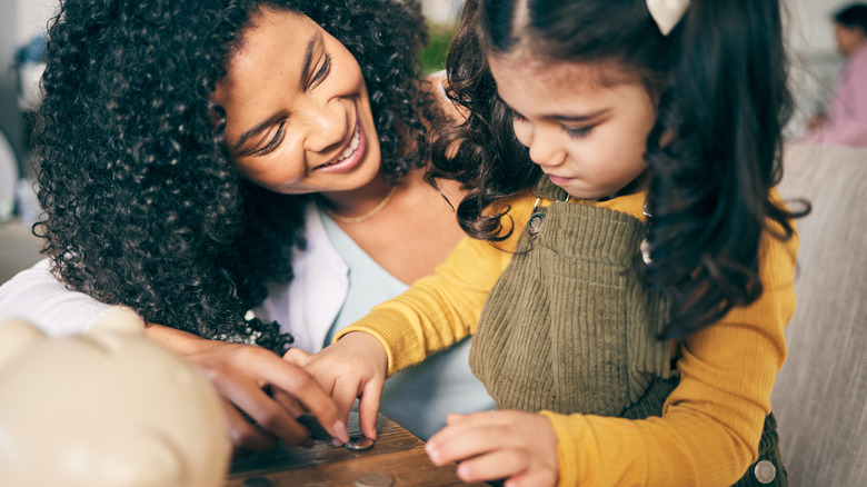 young child counting coins