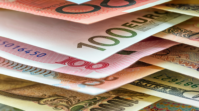 foreign currencies stacked up