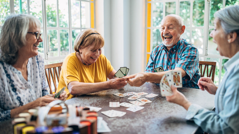 Group of seniors playing a card game
