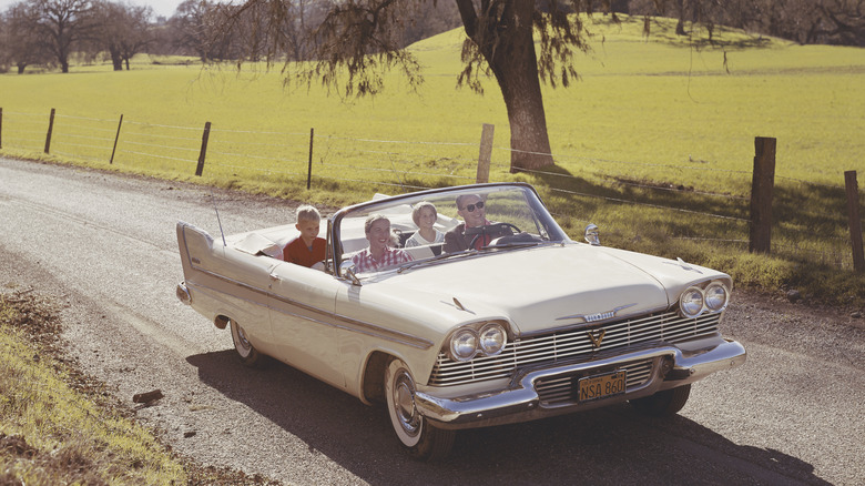 Vintage photo of a family traveling on a road trip