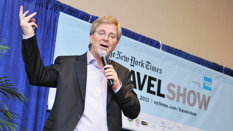 Rick Steves speaking with a microphone