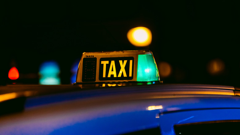 Luminous of a lit Taxi in Madrid, Spain at night