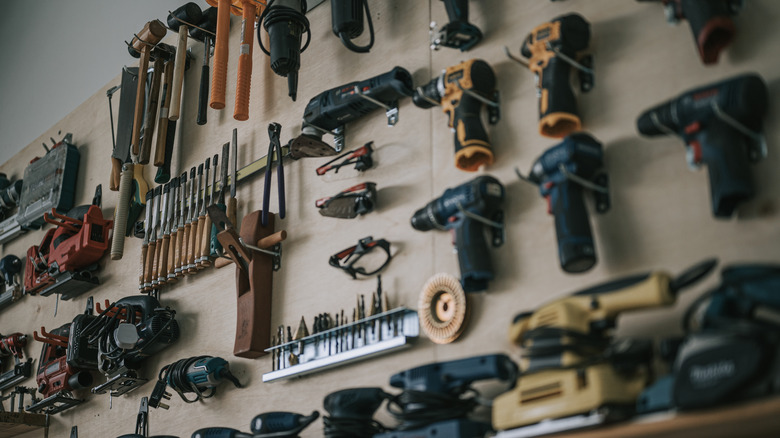 Hand tools and workbench in carpentry workshop