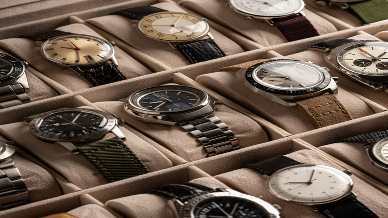 Collection of vintage watches in a display box