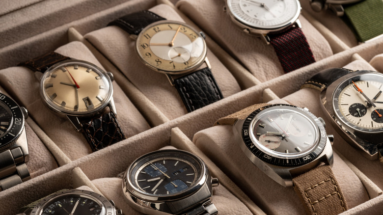 Collection of vintage watches in a display box