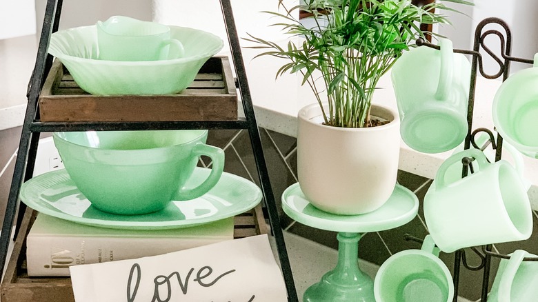 Examples of jadeite items on shelf display, table