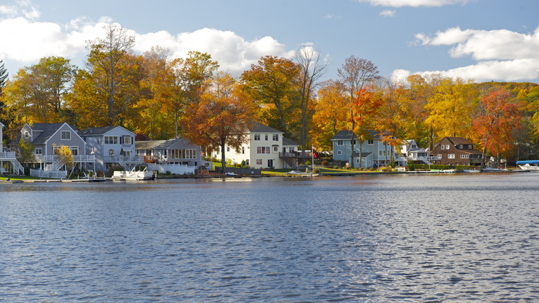 Winsted, Ct waterfront homes in autumn, trees changing color.