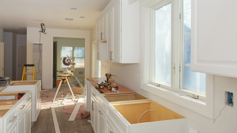 Kitchen cabinets of installation base of custom maker preparing kitchen.