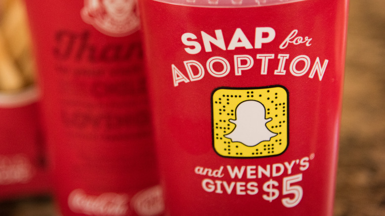 Drink cup featuring Wendy's promotional marketing partnership with Snapchat, a social media application for sharing videos, images, and messages.
