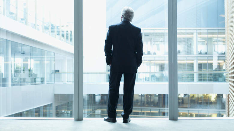 Man staring out the window and thinking