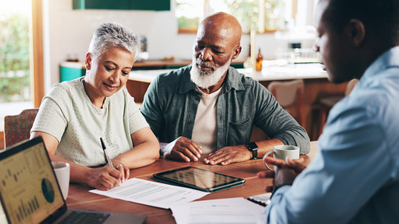 Older couple meeting with an investment advisor