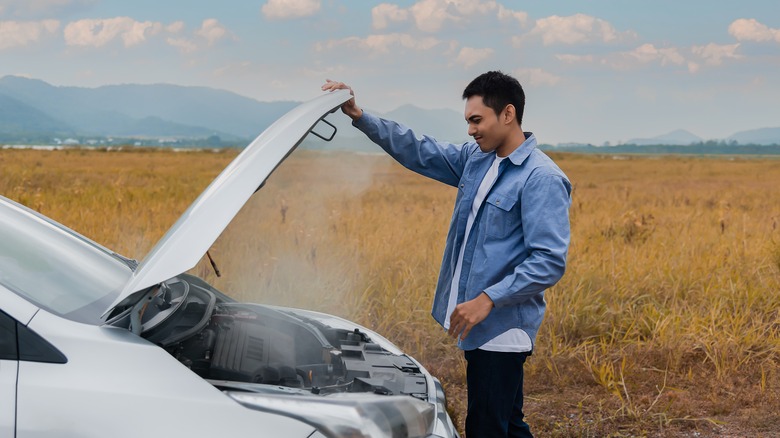 Broken down car on road