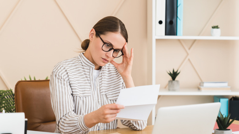 Young adult figures out a bill