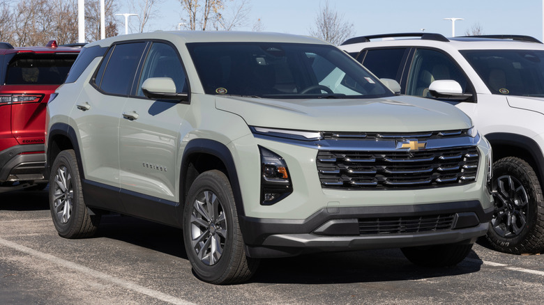 A grey Chevrolet Equinox on display at a dealership.