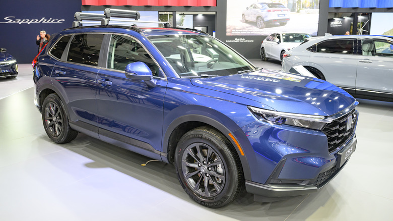 A blue Honda CR-V compact crossover SUV on display.