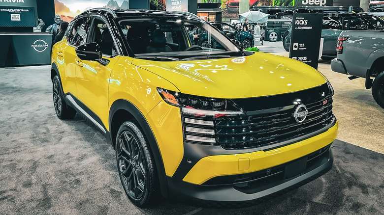 A yellow 2025 Nissan Kicks on display.