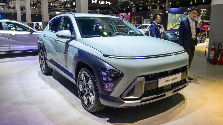 A Hyundai Kona Hybrid compact crossover SUV on display.