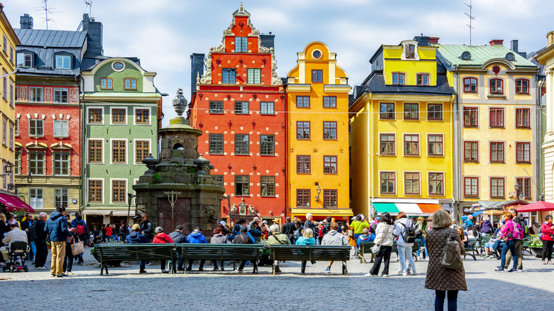 Dozens of people on a bustling street in Stockholm, Sweden