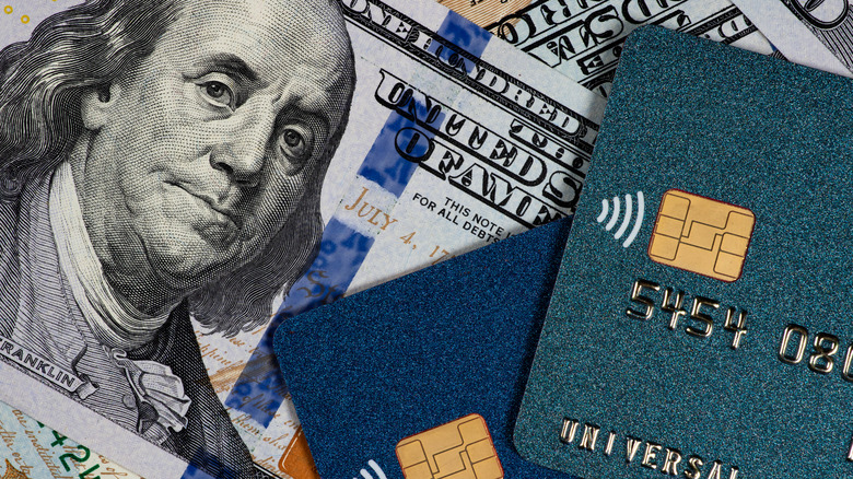 $100 bill and credit cards